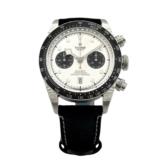 Tudor watch with black strap and white face on a white background